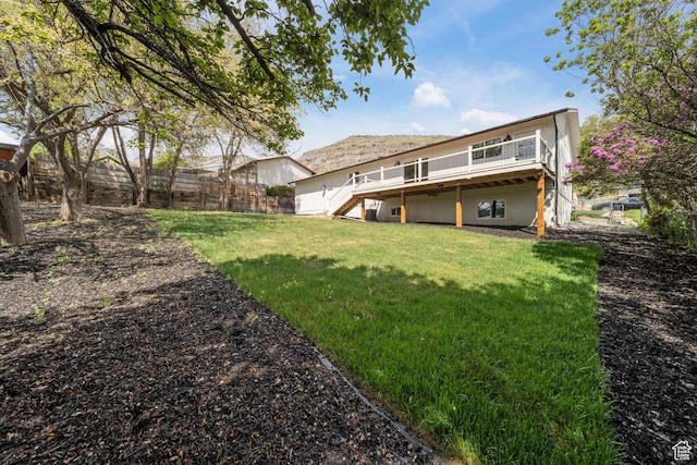770 S 1680 E, Pleasant Grove, UT 84062 - rear view of property featuring stairway, a deck, fence, and a lawn