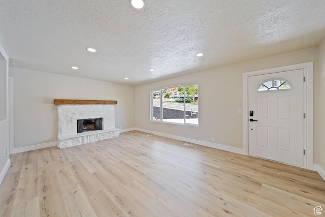 770 S 1680 E, Pleasant Grove, UT 84062 - unfurnished living room featuring recessed lighting, a textured ceiling, and light wood-style floors