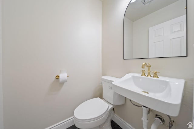 770 S 1680 E, Pleasant Grove, UT 84062 - bathroom featuring a sink, baseboards, and toilet