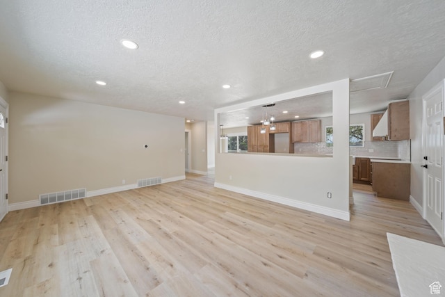 770 S 1680 E, Pleasant Grove, UT 84062 - unfurnished living room with recessed lighting, a textured ceiling, and visible vents