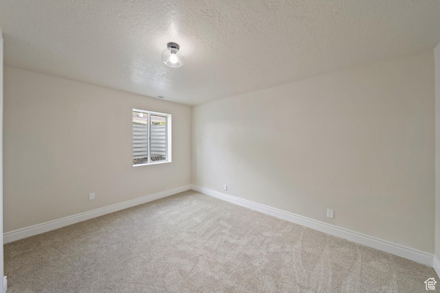 770 S 1680 E, Pleasant Grove, UT 84062 - spare room with baseboards, carpet, and a textured ceiling