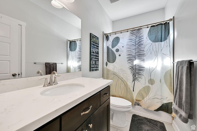 full bathroom with tile patterned floors, curtained shower, toilet, and vanity