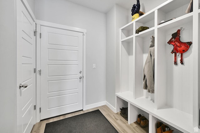 mudroom with light wood-type flooring and baseboards