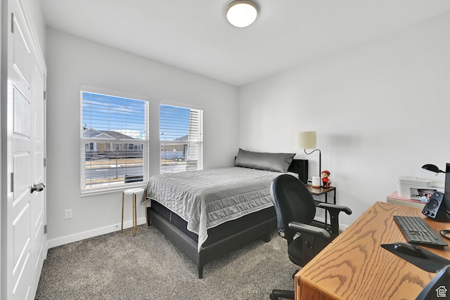 carpeted bedroom featuring baseboards