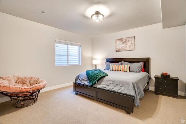 carpeted bedroom with baseboards