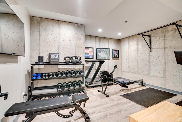 workout area featuring wood finished floors and recessed lighting