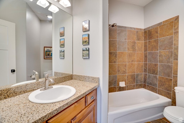bathroom with  shower combination, vanity, and toilet