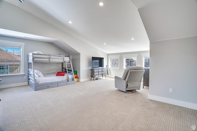 bedroom featuring baseboards, vaulted ceiling, and carpet floors