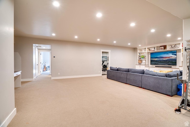 living room featuring baseboards, recessed lighting, and light carpet