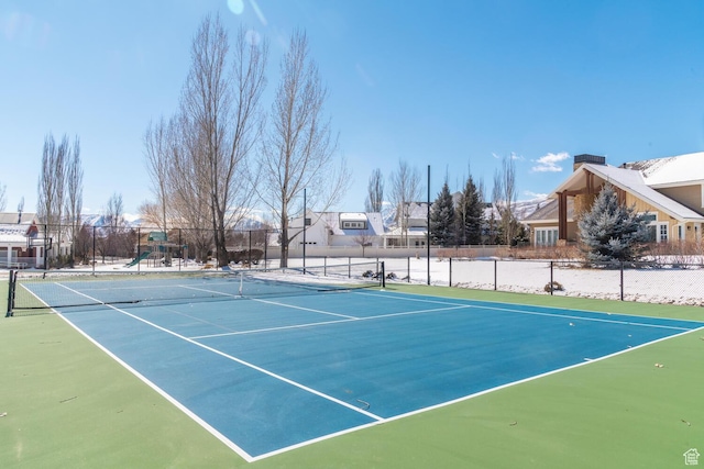 view of sport court featuring fence and playground community