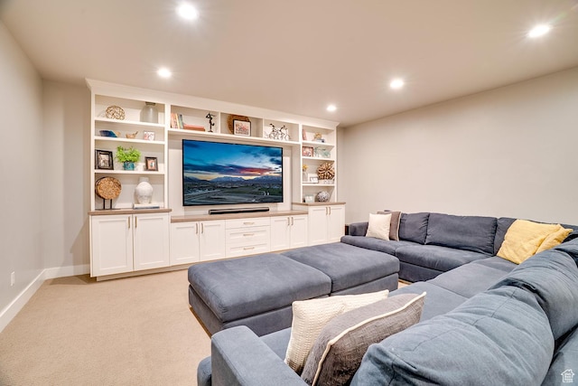 living area featuring light colored carpet, baseboards, and recessed lighting