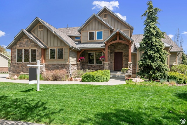 4048 W Ivy Ave, Mountain Green, UT 84050 - craftsman house featuring board and batten siding, stone siding, a front lawn, and a shingled roof