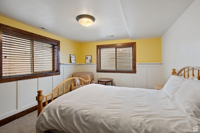 4048 W Ivy Ave, Mountain Green, UT 84050 - bedroom featuring a wainscoted wall and a decorative wall