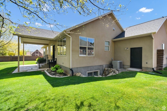 rear view of property with cooling unit, stucco siding, and a patio