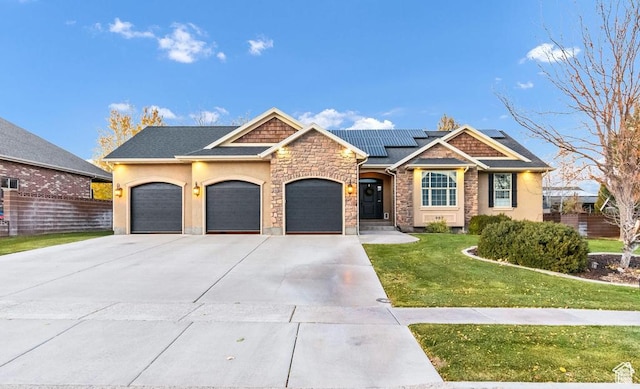 craftsman-style house featuring a garage, concrete driveway, solar panels, stone siding, and stucco siding