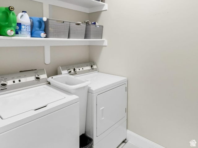 washroom with washing machine and clothes dryer