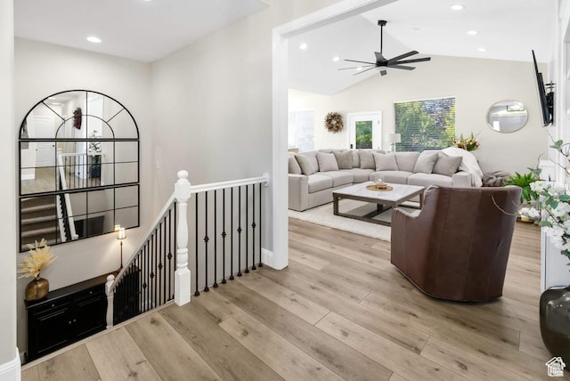 living area with a ceiling fan, light wood-type flooring, recessed lighting, and high vaulted ceiling