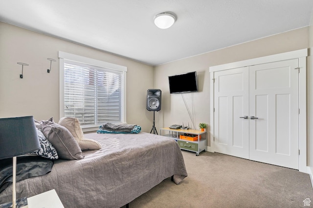 bedroom with light colored carpet