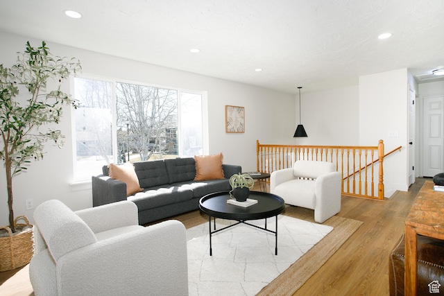 living area featuring recessed lighting and light wood-style floors