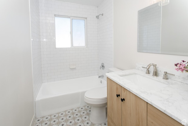 bathroom featuring vanity, toilet, and washtub / shower combination