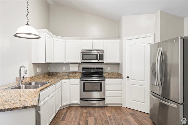 kitchen featuring white cabinetry, dark wood-style floors, appliances with stainless steel finishes, and a sink