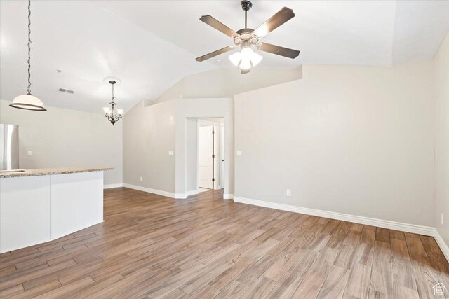 684 S 2150 W Unit 303, Pleasant Grove, UT 84062 - unfurnished living room with visible vents, baseboards, lofted ceiling, and light wood-style floors