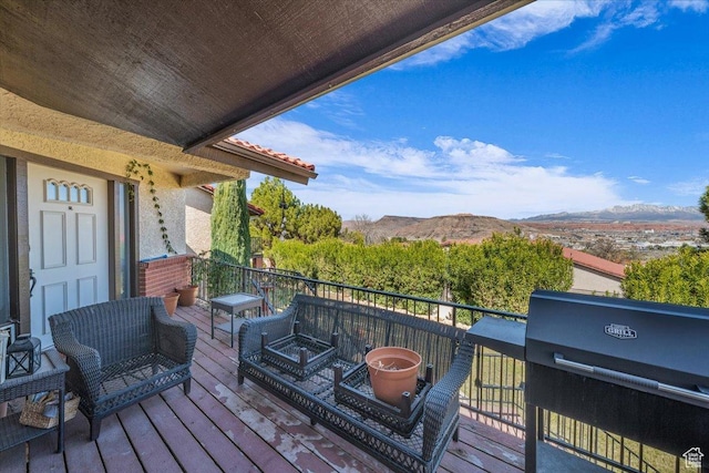 wooden deck with a mountain view