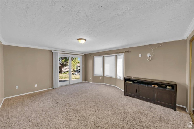 unfurnished living room featuring light carpet, a textured ceiling, crown molding, and baseboards
