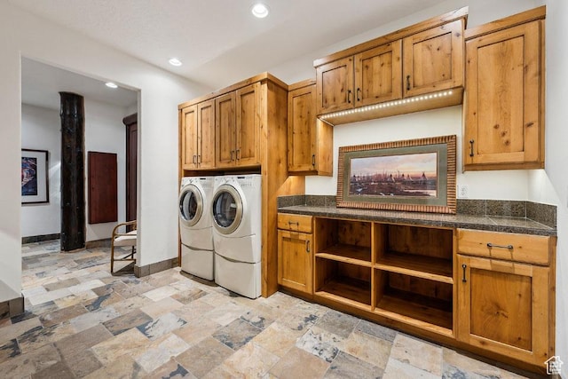 3438 Snow Top Ct, Park City, UT 84060 - washroom with stone tile floors, baseboards, recessed lighting, cabinet space, and washing machine and dryer