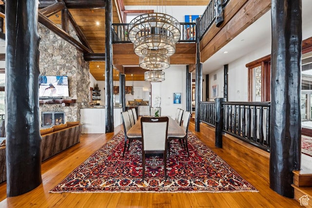 3438 Snow Top Ct, Park City, UT 84060 - dining area with high vaulted ceiling, an inviting chandelier, and wood finished floors