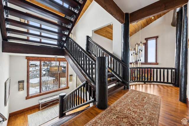 3438 Snow Top Ct, Park City, UT 84060 - stairway with beamed ceiling, wood finished floors, baseboards, and high vaulted ceiling