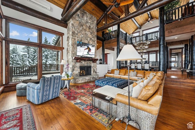 3438 Snow Top Ct, Park City, UT 84060 - living area with beam ceiling, a fireplace, wooden ceiling, high vaulted ceiling, and wood-type flooring