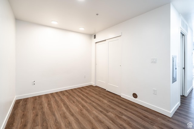 443 Kane Creek Blvd Unit 111, Moab, UT 84532 - unfurnished bedroom with wood finished floors, baseboards, visible vents, and a closet