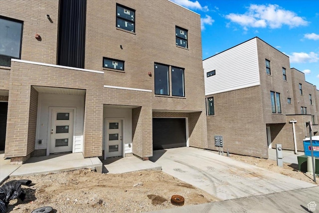 14404 S Champ Cv E Unit 144, Draper, UT 84020 - exterior space with an attached garage and concrete driveway