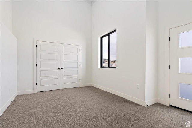14404 S Champ Cv E Unit 144, Draper, UT 84020 - carpeted foyer entrance featuring baseboards and a towering ceiling