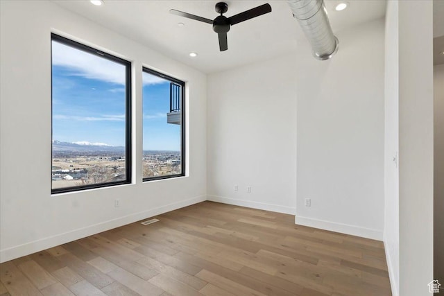 14404 S Champ Cv E Unit 144, Draper, UT 84020 - unfurnished room featuring visible vents, ceiling fan, baseboards, recessed lighting, and wood finished floors