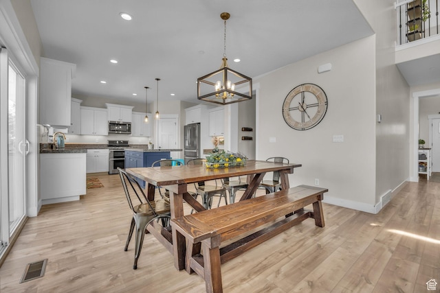 203 E Deer Run Loop Unit 40, Elk Ridge, UT 84651 - dining area featuring light wood finished floors, recessed lighting, a chandelier, and baseboards