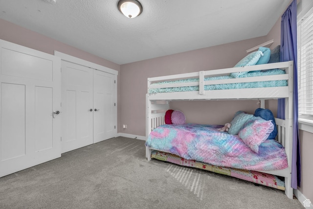 203 E Deer Run Loop Unit 40, Elk Ridge, UT 84651 - bedroom featuring carpet, a closet, baseboards, and a textured ceiling