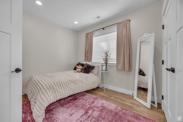 203 E Deer Run Loop Unit 40, Elk Ridge, UT 84651 - bedroom with wood finished floors, baseboards, and recessed lighting