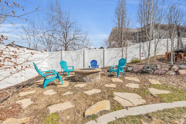 203 E Deer Run Loop Unit 40, Elk Ridge, UT 84651 - fenced backyard featuring an outdoor fire pit