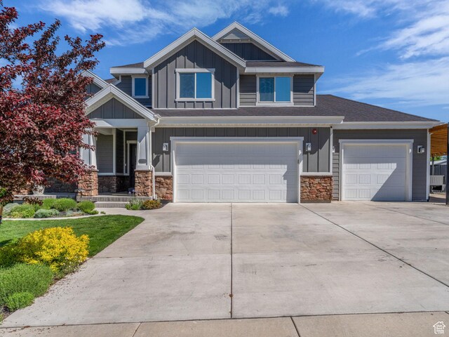 203 E Deer Run Loop Unit 40, Elk Ridge, UT 84651 - craftsman house with board and batten siding, stone siding, and driveway