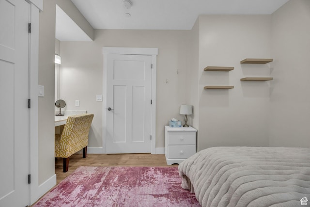 203 E Deer Run Loop Unit 40, Elk Ridge, UT 84651 - bedroom featuring wood finished floors and baseboards