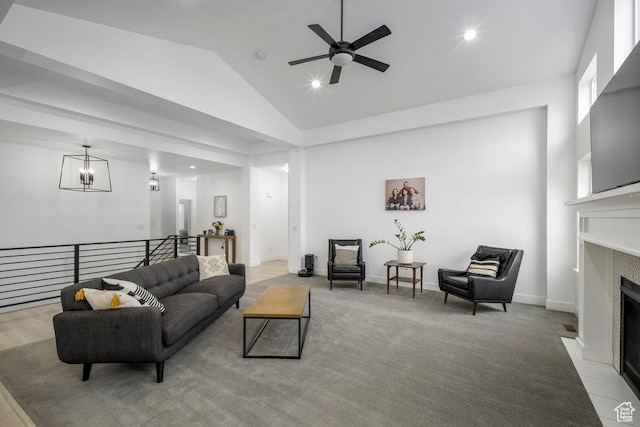 carpeted living area featuring a fireplace with flush hearth, recessed lighting, baseboards, and high vaulted ceiling