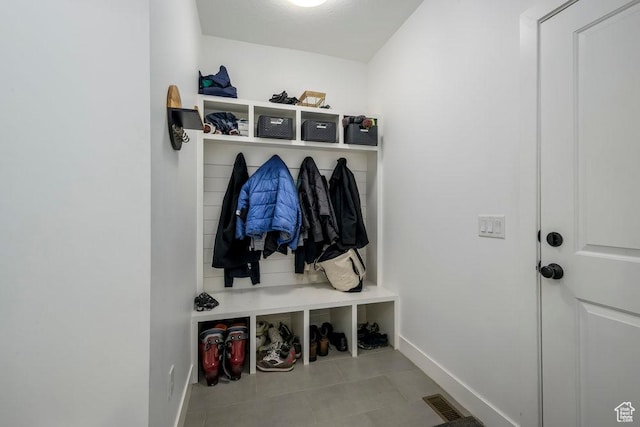 mudroom featuring visible vents, baseboards, and tile patterned flooring