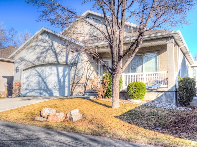 view of front of home with a porch, an attached garage, concrete driveway, and stucco siding