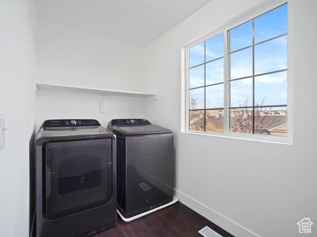7009 W 7895 S, West Jordan, UT 84081 - laundry area with dark wood-style floors, laundry area, washer and dryer, and baseboards