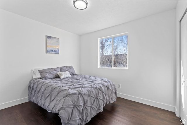 7009 W 7895 S, West Jordan, UT 84081 - bedroom featuring baseboards and wood finished floors