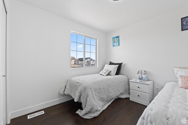 7009 W 7895 S, West Jordan, UT 84081 - bedroom featuring visible vents, baseboards, and wood finished floors