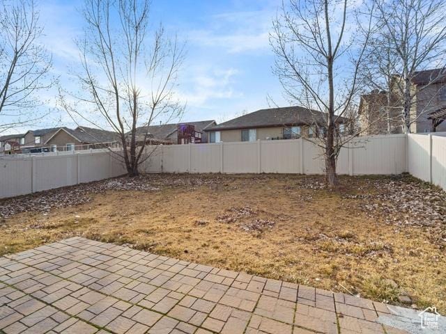 7009 W 7895 S, West Jordan, UT 84081 - view of yard with a patio area and a fenced backyard