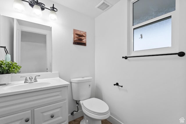 7009 W 7895 S, West Jordan, UT 84081 - half bath featuring visible vents, baseboards, toilet, and vanity